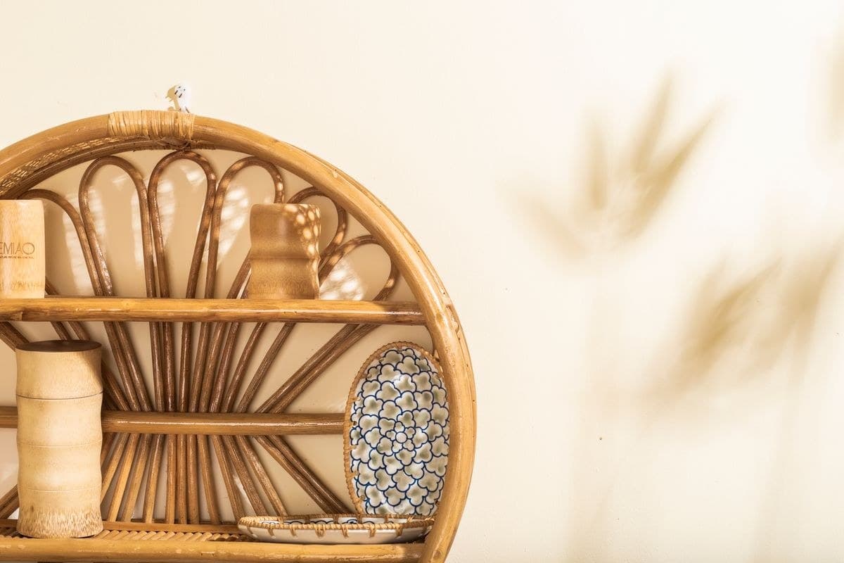 Cane Bookshelf, styled with books and objects
